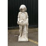 A painted reconstituted stone/concrete garden figure, boy with two puppies, 120cm high