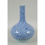 A C19th Chinese blue and white porcelain bottle vase with scrolling floral decoration, AF repair,