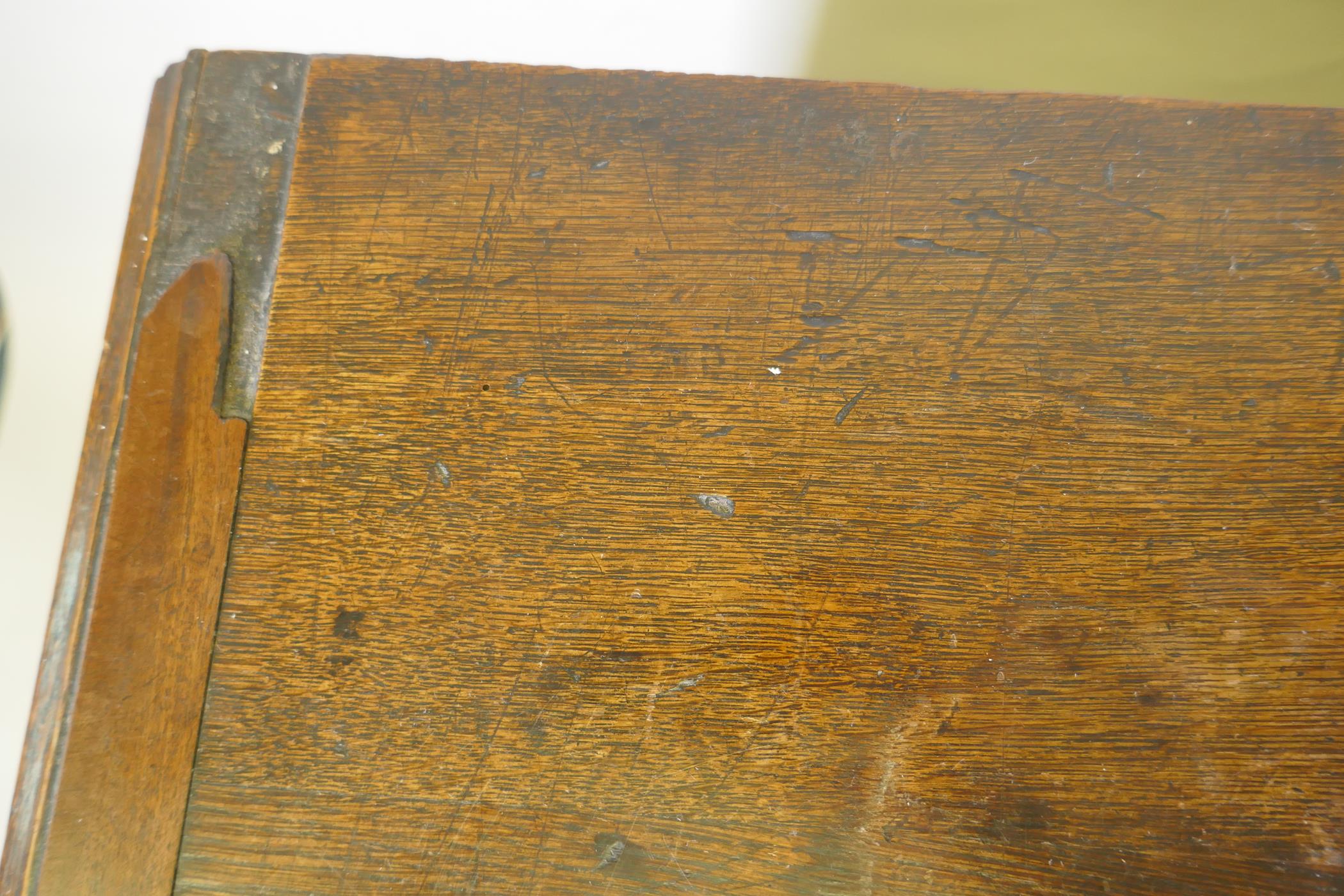 A Georgian oak chest of two over three drawers, mahogany banded top, cockbeaded drawers with - Image 6 of 7