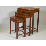 A nest of three Chinese hardwood occasional tables, 48 x 36 x 69cm