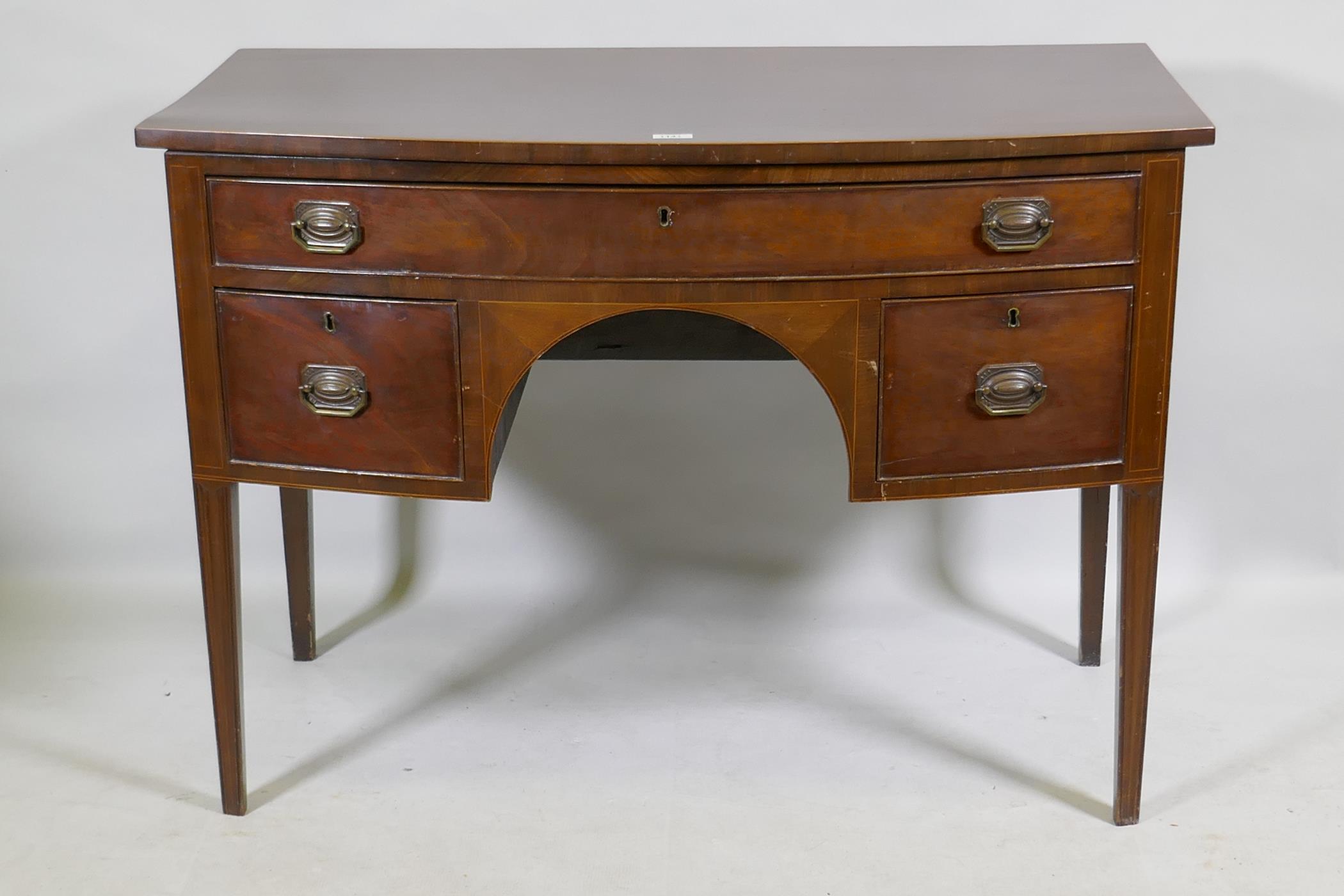 C19th mahogany three drawer bow fronted kneehole dressing table/desk, with original plate handles,