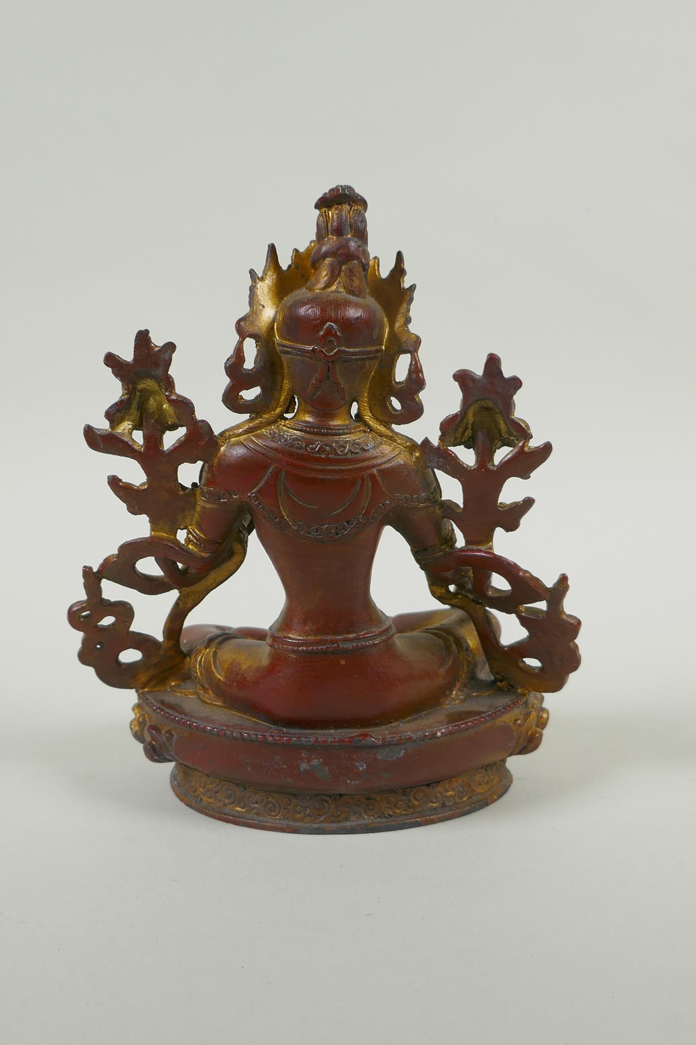 A Tibetan bronze figure of white tara with gilt and copper patina, 20cm high - Image 3 of 4