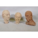 Three terracotta sculpted busts of men, signed W.B., 30cm high