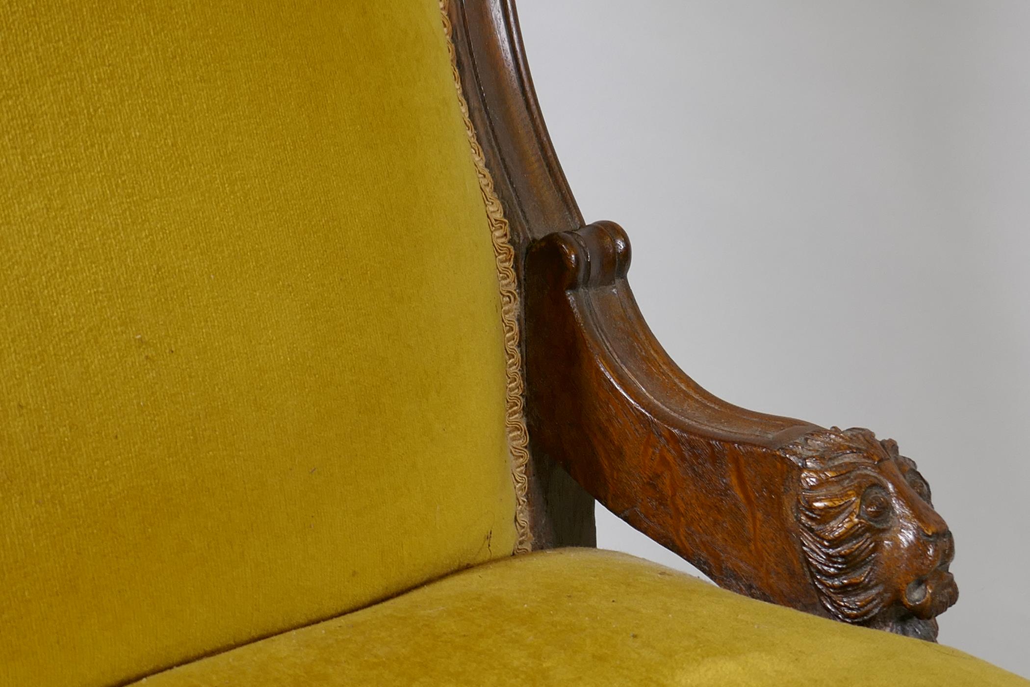 A C19th oak nursing chair with carved lion mask decoration, raised on turned supports - Image 4 of 4