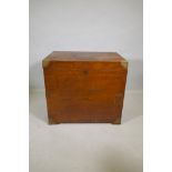 A C19th teak silver chest with campaign/military style brass mounts and handles and inset panel,