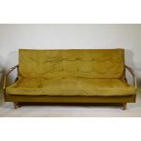 A mid century teak sofa bed in the manner of Greaves & Thomas, structurally sound, upholstery AF,