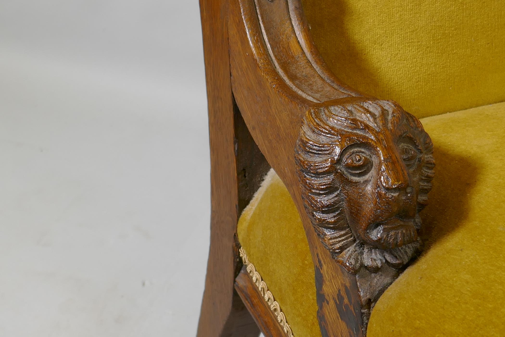 A C19th oak nursing chair with carved lion mask decoration, raised on turned supports - Image 3 of 4