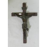A C19th Continental bronze Corpus Christi, mounted on an oak crucifix with tablet, marked AA,