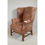 A Georgian style wingback armchair