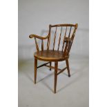 An antique bentwood elbow chair, back legs reduced