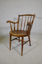 An antique bentwood elbow chair, back legs reduced