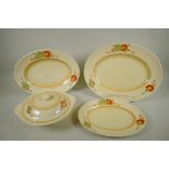 A set of Newport Pottery Clarice Cliff Corolla pattern oval serving dishes and tureen, largest 41