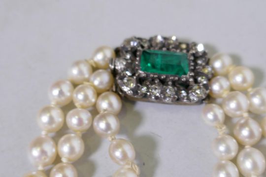 An antique three string cultured pearl necklace with white metal clasp set with paste stones, by - Image 3 of 3