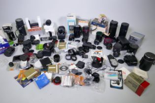 Collection of 35mm camera lenses, Kiron 28-70mm f/3.5-4.5 Macro Zoom lens in manufacturer's