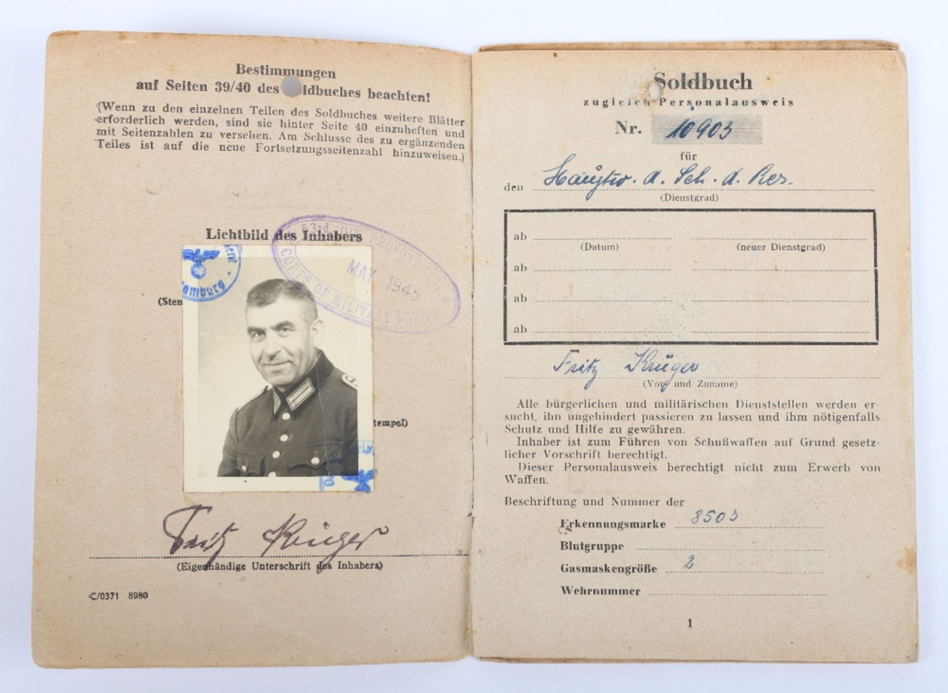 WW2 German SS-Polizei Soldbuch to Hauptwachmeister der Reserve Fritz Krüger. Late, 5 April 1945 issu