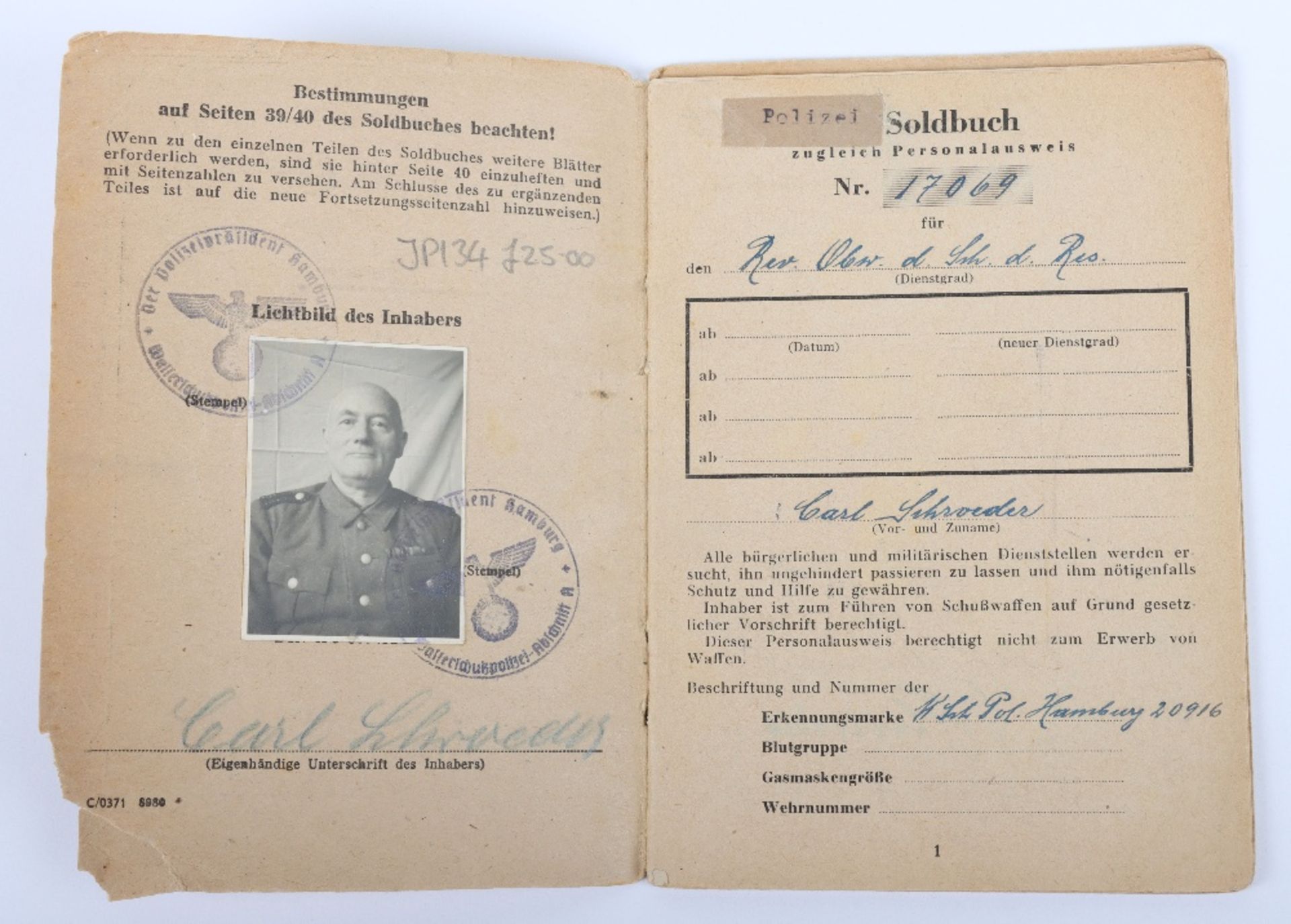 WW2 German SS-Polizei Soldbuch to Oberwachmeister der Reserve Carl Schroeder. Late, 23. March 1945 i