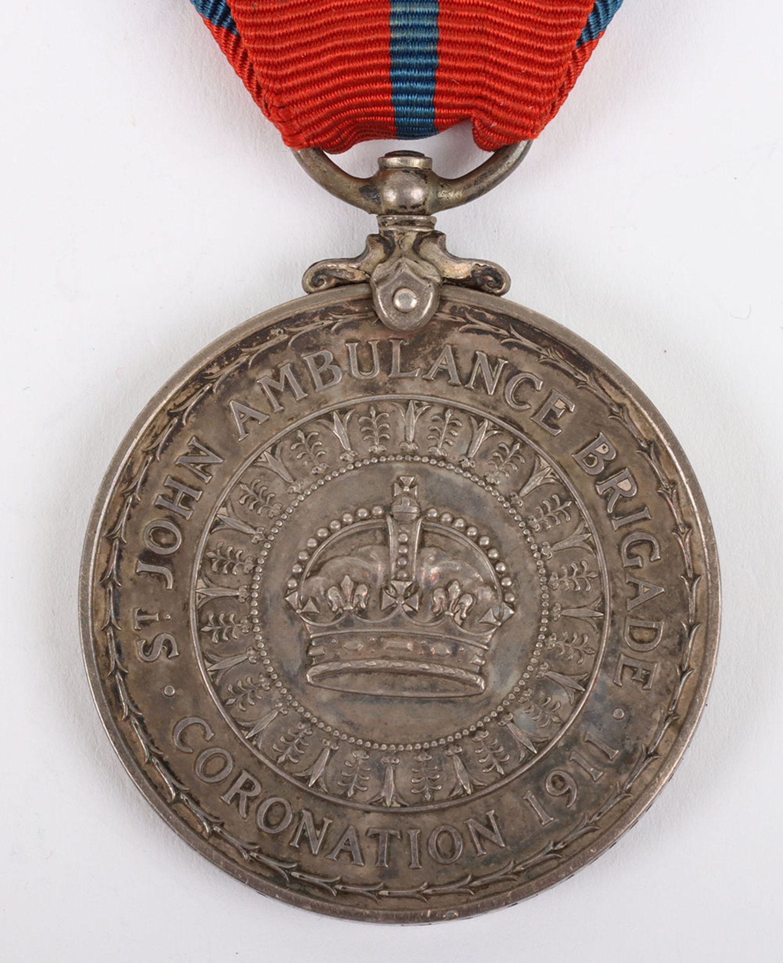 An unusual 1911 Coronation medal to a Storeman in the St Johns Ambulance Brigade - Image 4 of 4