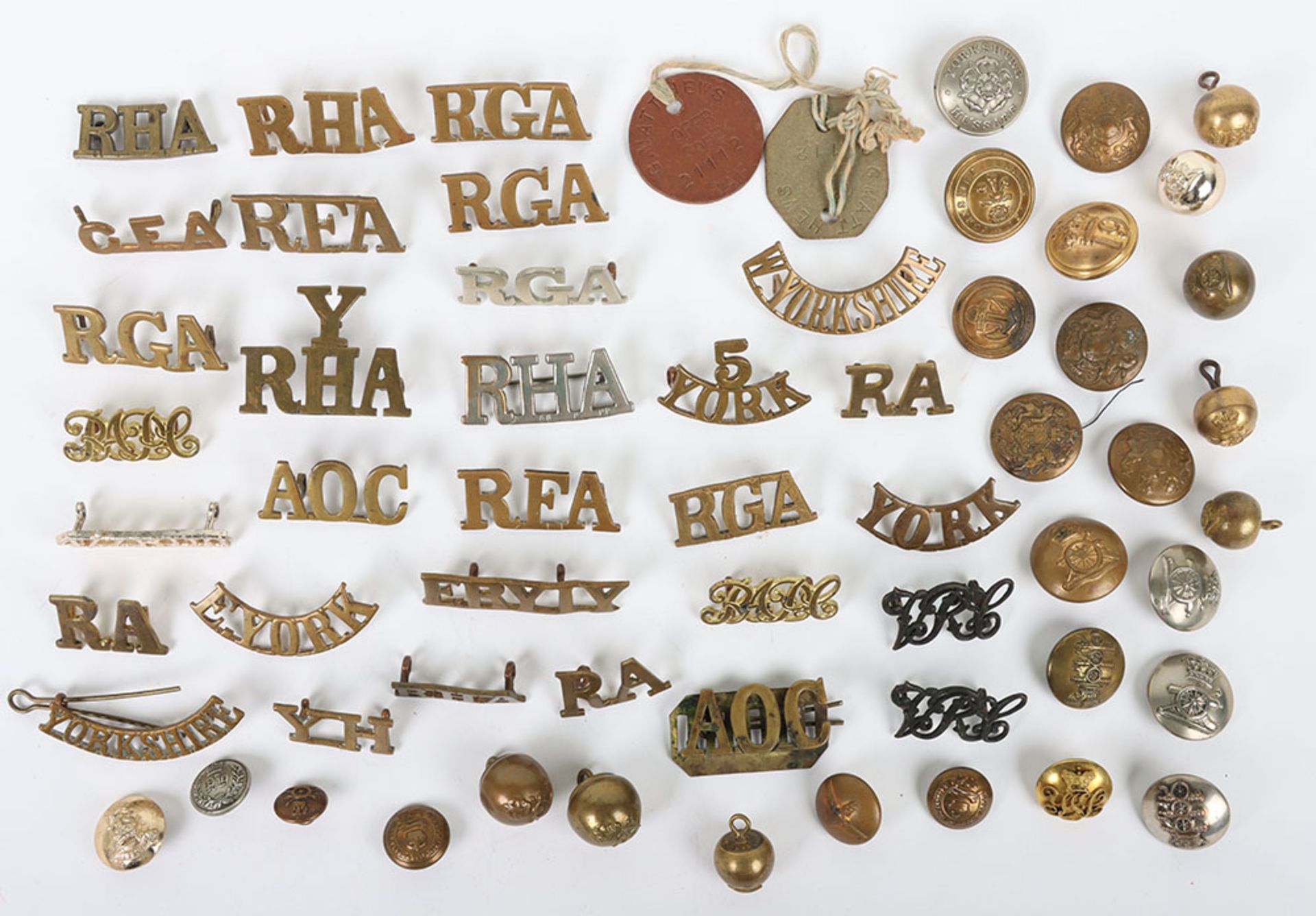 Collection of shoulder titles, buttons, collar dogs