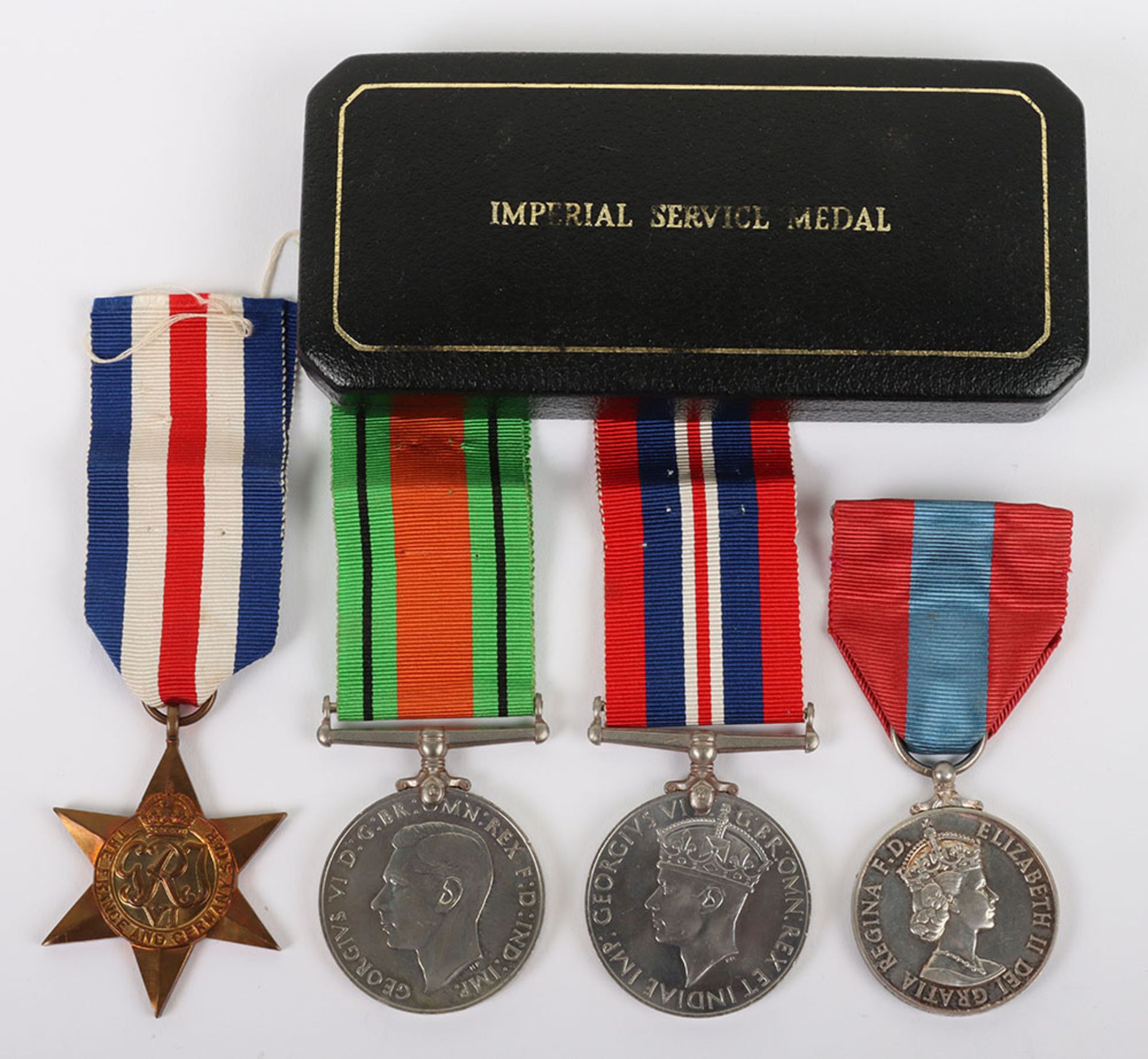 A Second World War and later group of 4 medals to a London Postman