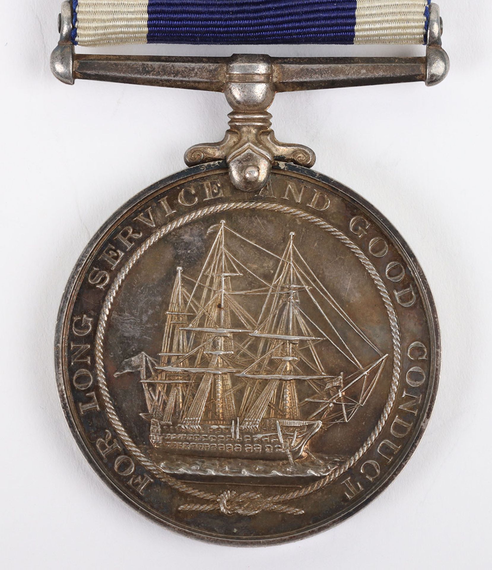 A single Royal Navy Long Service and Good Conduct medal to H.M.S Defiance - Image 5 of 5