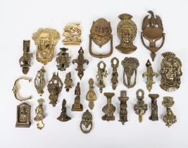 A good selection of brass door knockers, including Elizabeth I, Charles II, Eagle, Shakespeare