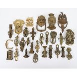 A good selection of brass door knockers, including Elizabeth I, Charles II, Eagle, Shakespeare