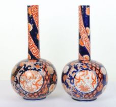 A pair of Japanese Imari bottle vases