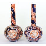 A pair of Japanese Imari bottle vases