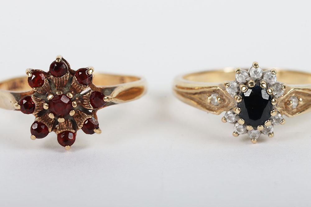 A group of four 9ct rings, including a 9ct ruby flower set ring, with a peridot and diamond ring, a - Image 2 of 6