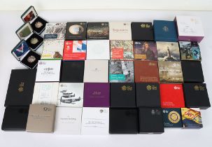 A large amount of cased silver proof Royal Mint coins, including £5, £2, commemorative issues, some