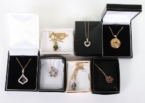 Seven modern 18ct and 9ct and gem set pendant necklaces