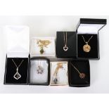 Seven modern 18ct and 9ct and gem set pendant necklaces