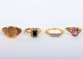 Four 9ct gold rings