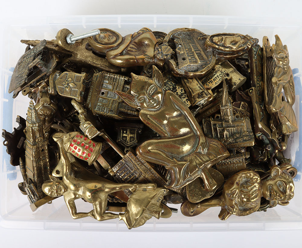 A large selection of brass door knockers