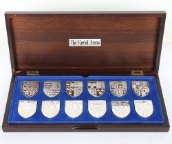 A set of silver Royal Coat of Arms