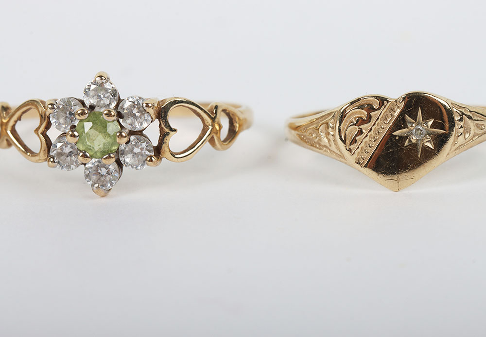 A group of four 9ct rings, including a 9ct ruby flower set ring, with a peridot and diamond ring, a - Image 3 of 6