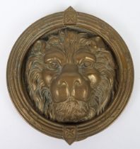 A 19th century large brass lion mask door knocker
