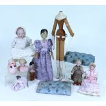 A collection of dolls, parts and related items,