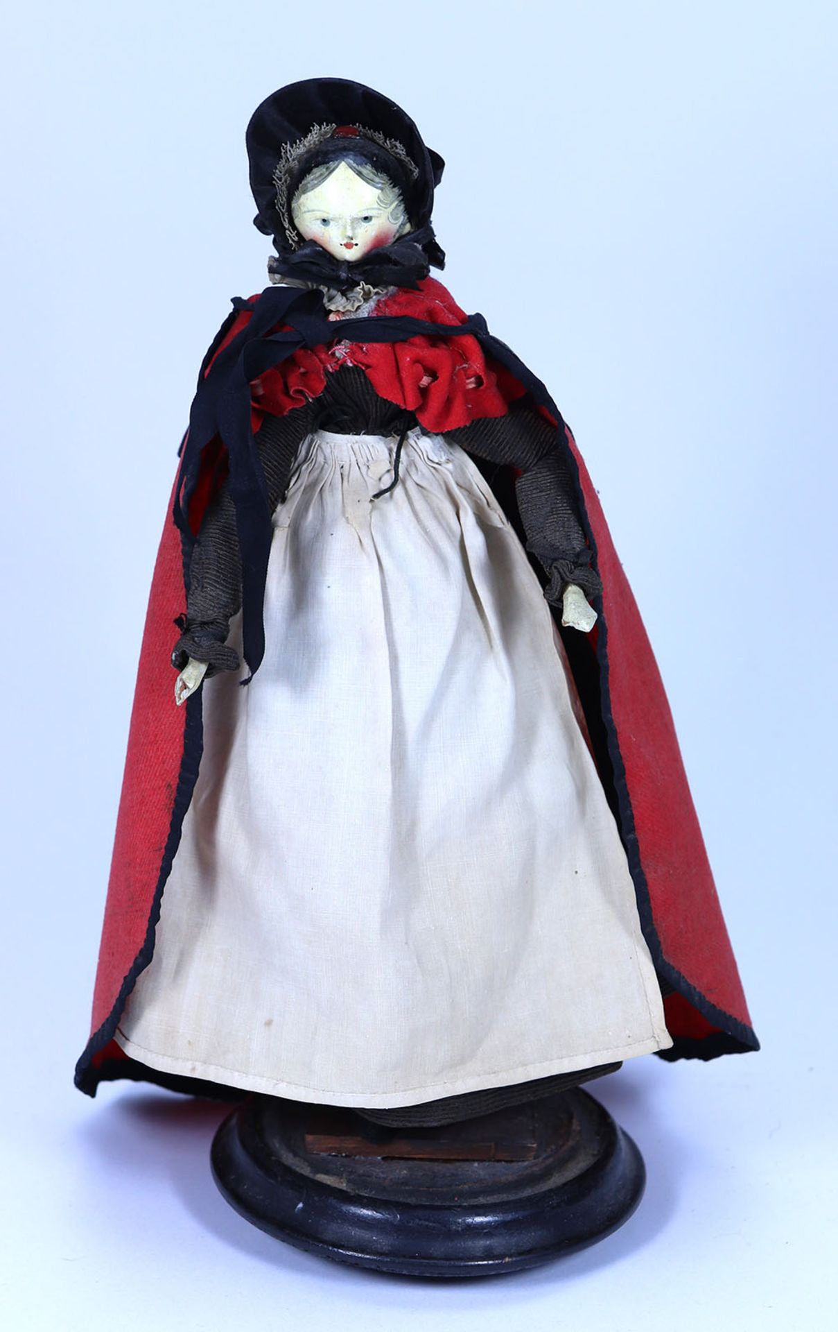 A good large painted wooden Grodnertal doll in original clothes, German 1820s