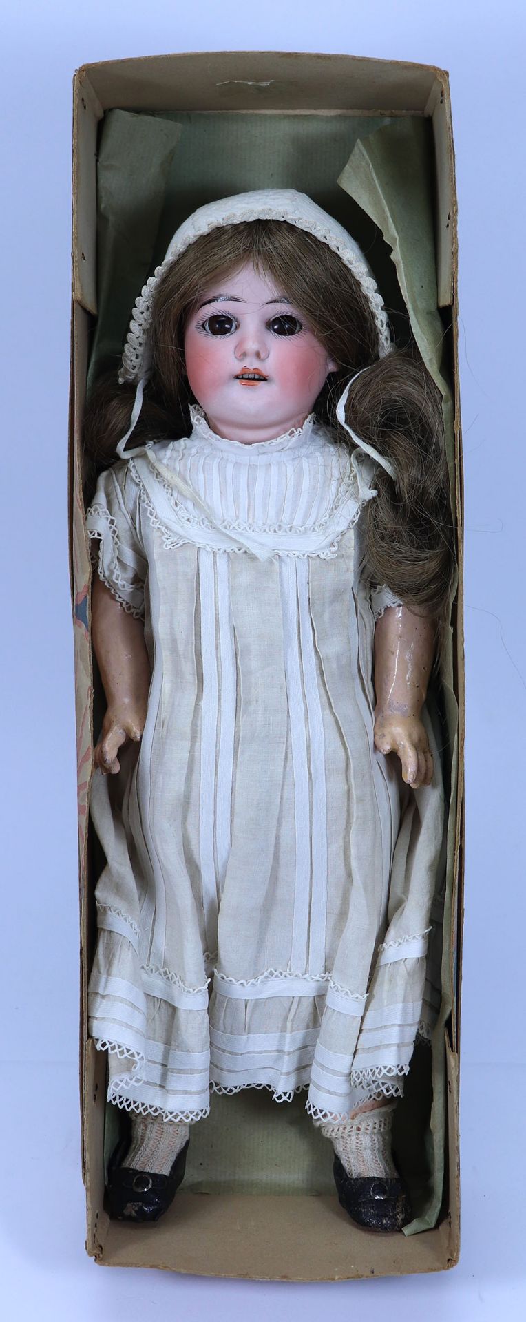 A bisque head girl doll in original box, French circa 1910,