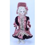 A reproduction Schmitt bisque head Bebe doll,