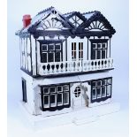 A painted wooden Dolls House in the Hobby Craft style, early 20th century,