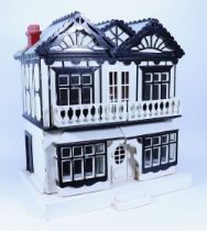 A painted wooden Dolls House in the Hobby Craft style, early 20th century,