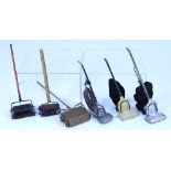 Six Dolls House carpet sweeps and Hoovers,