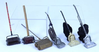 Six Dolls House carpet sweeps and Hoovers,