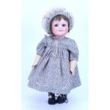 An A.M 323 bisque head ‘googly-eyed’ doll, German circa 1910,