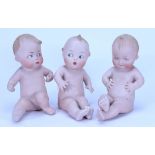 A set of three Gebruder Heubach all-bisque ‘Cutie’ dolls, German circa 1910,