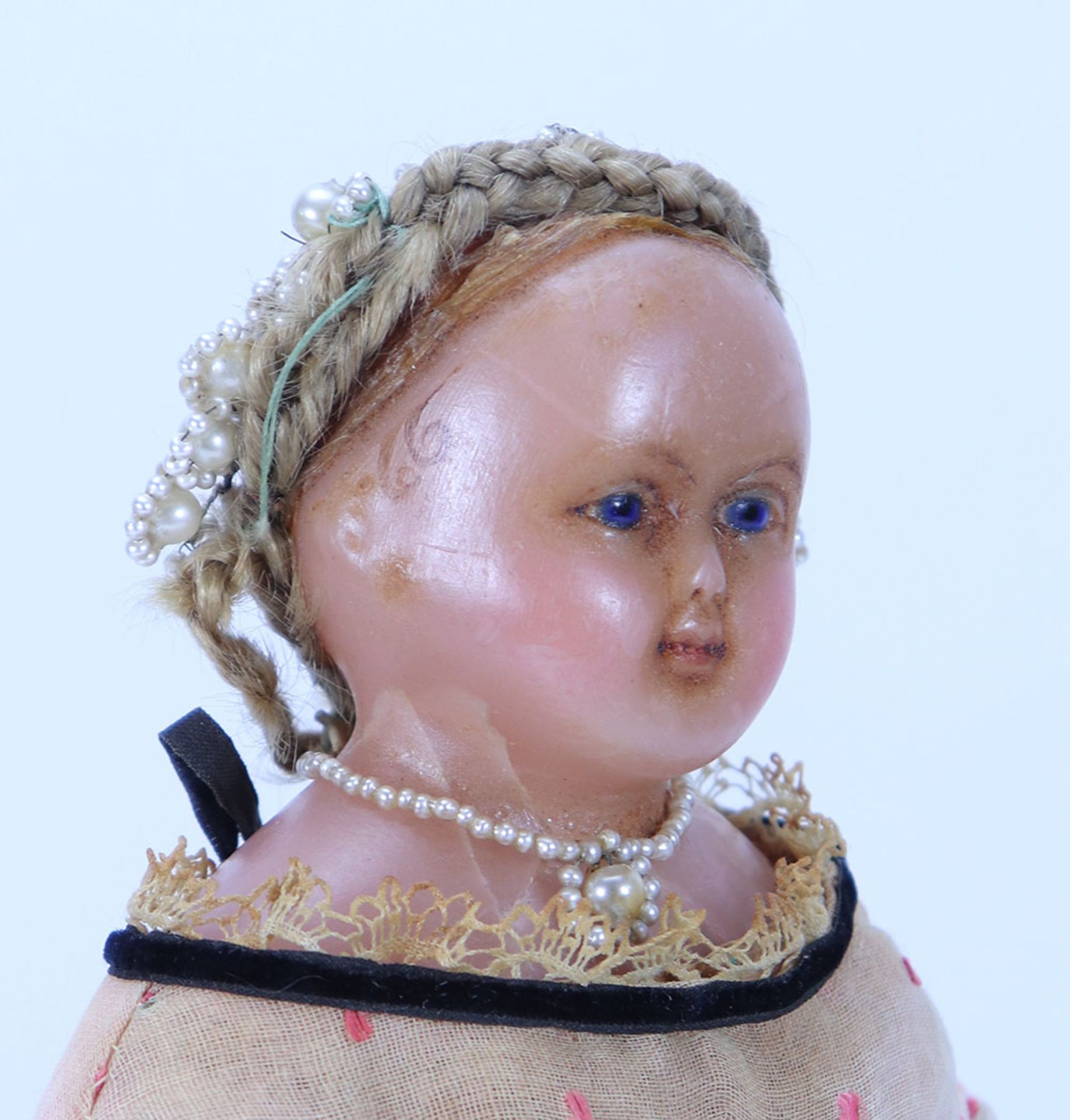 A poured wax shoulder head doll, English 1860s,