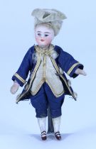 A miniature all-bisque boy doll in original clothes, French circa 1890,