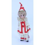 A miniature all original all-bisque doll in clown outfit, German circa 1910,